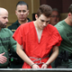 Nikolas Cruz is escorted into the courtroom for his arraignment at the Broward County Courthouse in Fort Lauderdale, Fla., on March 14, 2018. Cruz is accused of opening fire at Marjory Stoneman Douglas High School in Parkland, Fla., on Feb. 14, 2018, killing 17 students and adults.